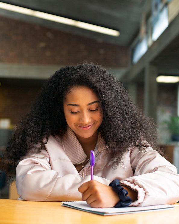 photo of student doing work at desk